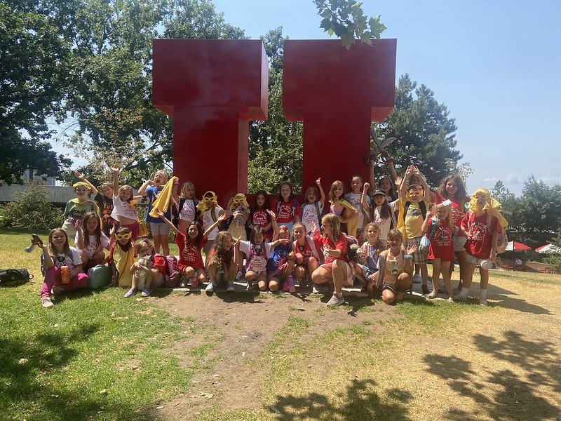 Youth Theatre summer 24 participants in front of the big red Block U