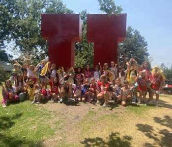 Youth Theatre summer 24 participants in front of the big red Block U