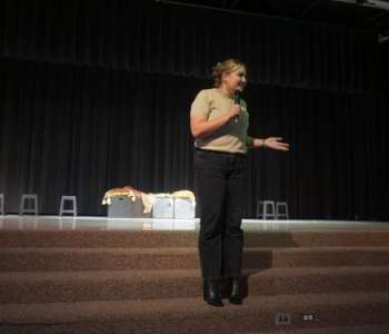 Emily Tatem introducing the show at Springville Middle School (Photo: Bryce Romleski) 